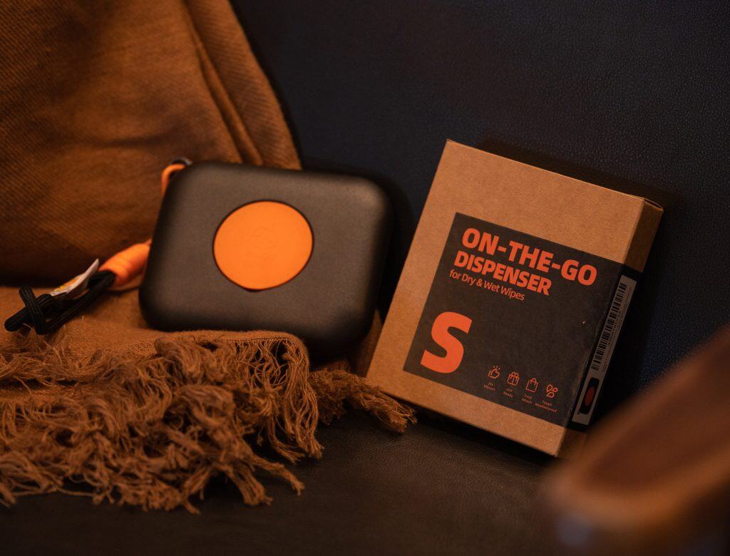 On-the-go dispenser package for dry & wet wipes, easy travel-friendly cleaning essential.