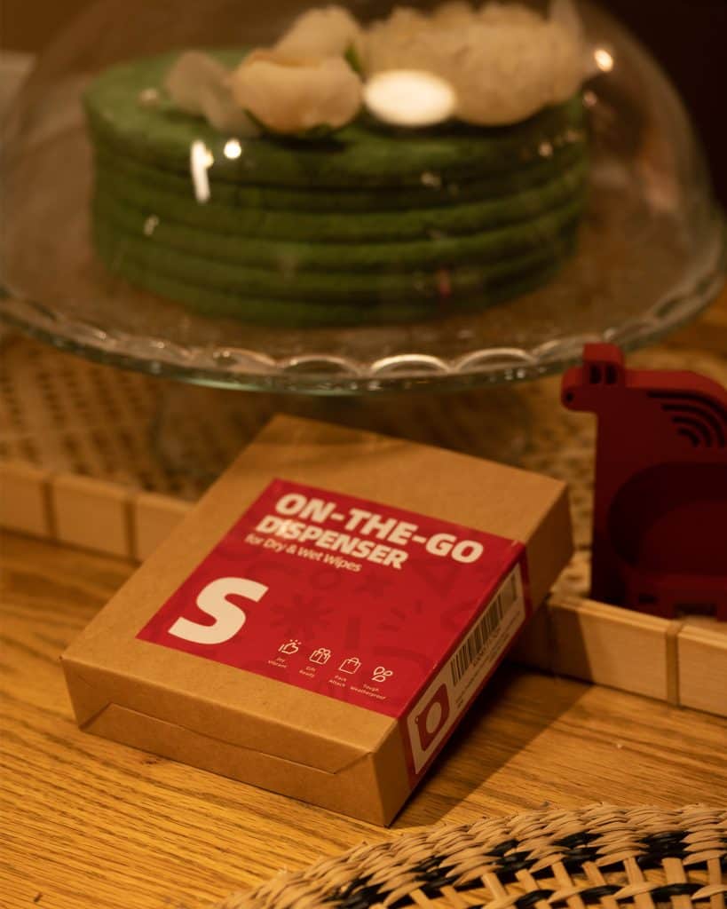 Portable wet wipe dispenser for easy hygiene on the move, perfect for travel and outdoor activities.